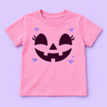 Camiseta rosada con cara de calabaza