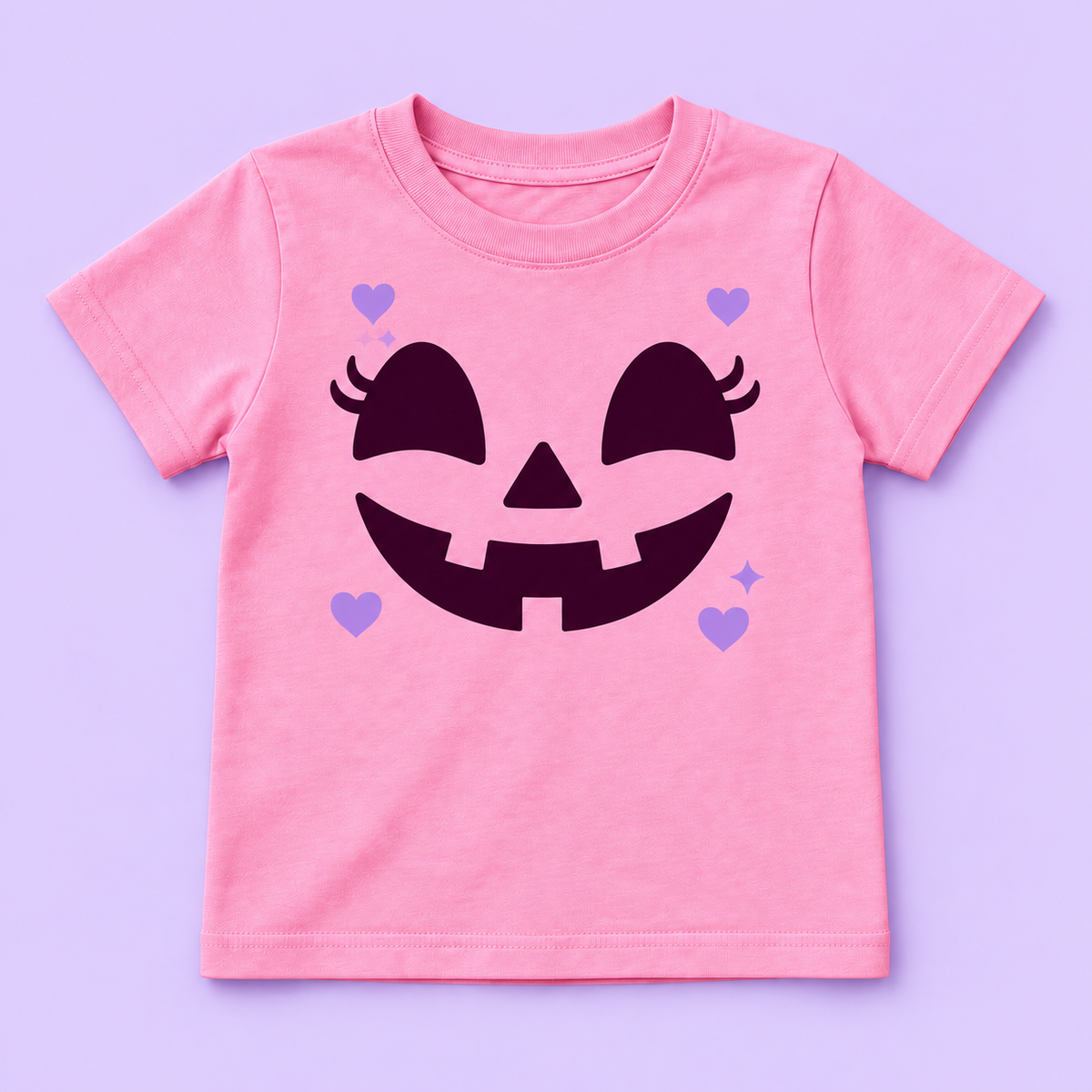 Camiseta rosada con cara de calabaza